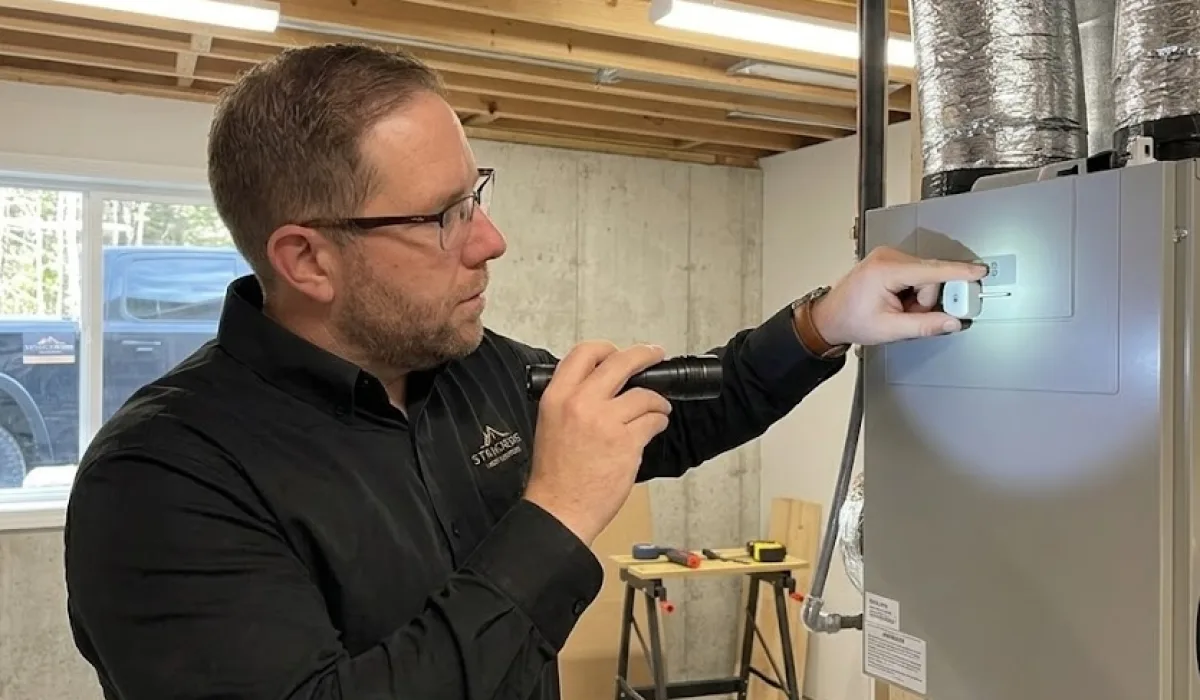 Modern utility room with HRV system and electrical setup under inspection