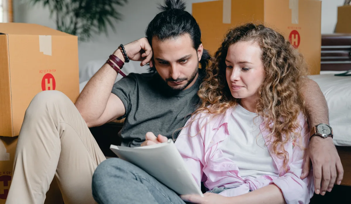 Buyer and seller reviewing a checklist during inspection-related negotiation