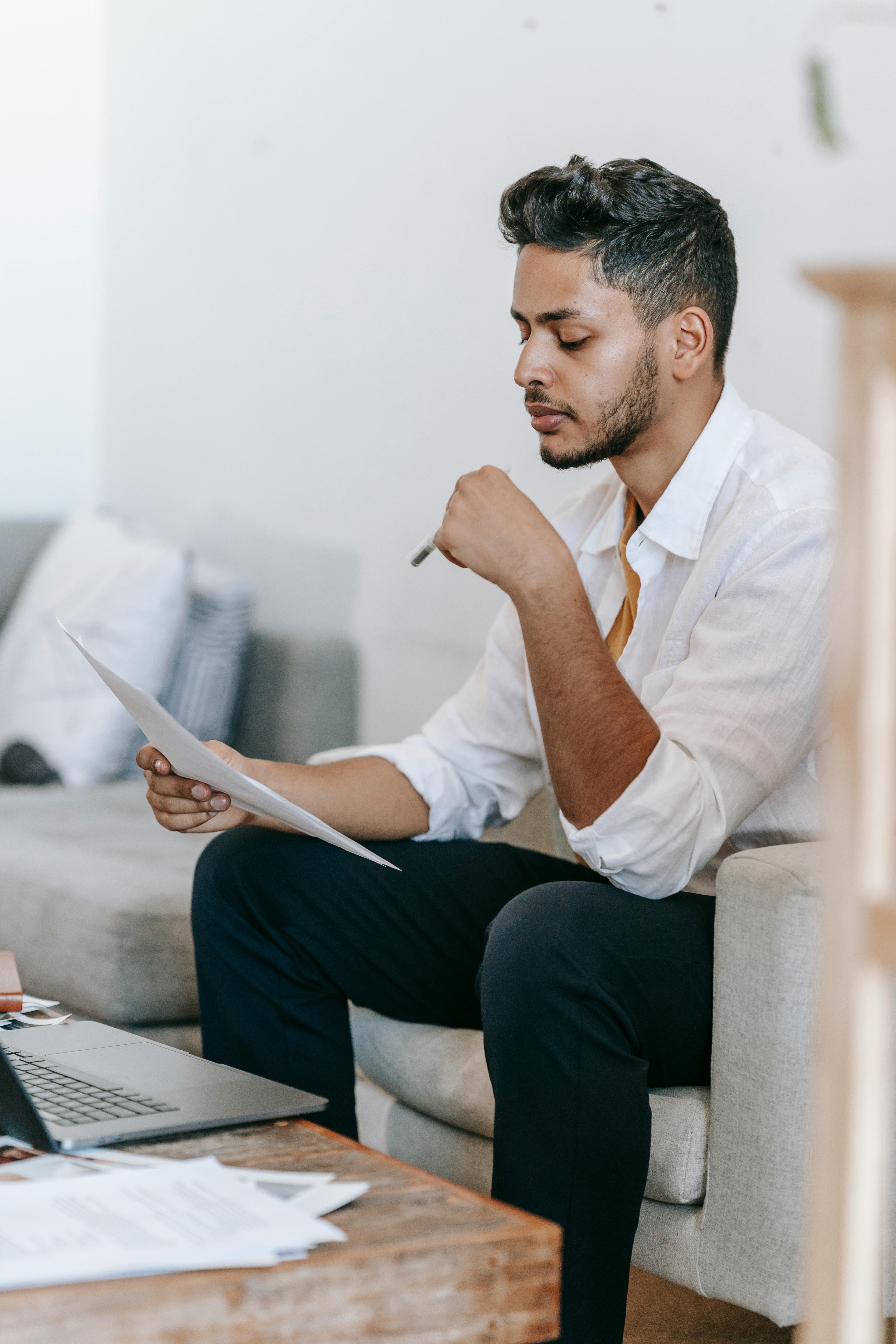 Man reviewing documents and budget details